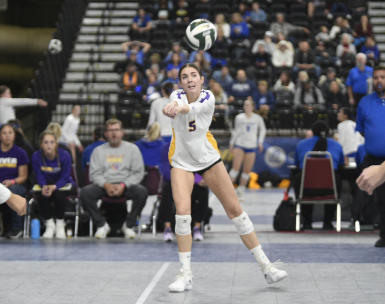 Columbia River&iacute;s Lauren Dreves (5) makes a dig during the Class 2A volleyball state semifinals match against Burlington-Edison on Saturday, Nov.