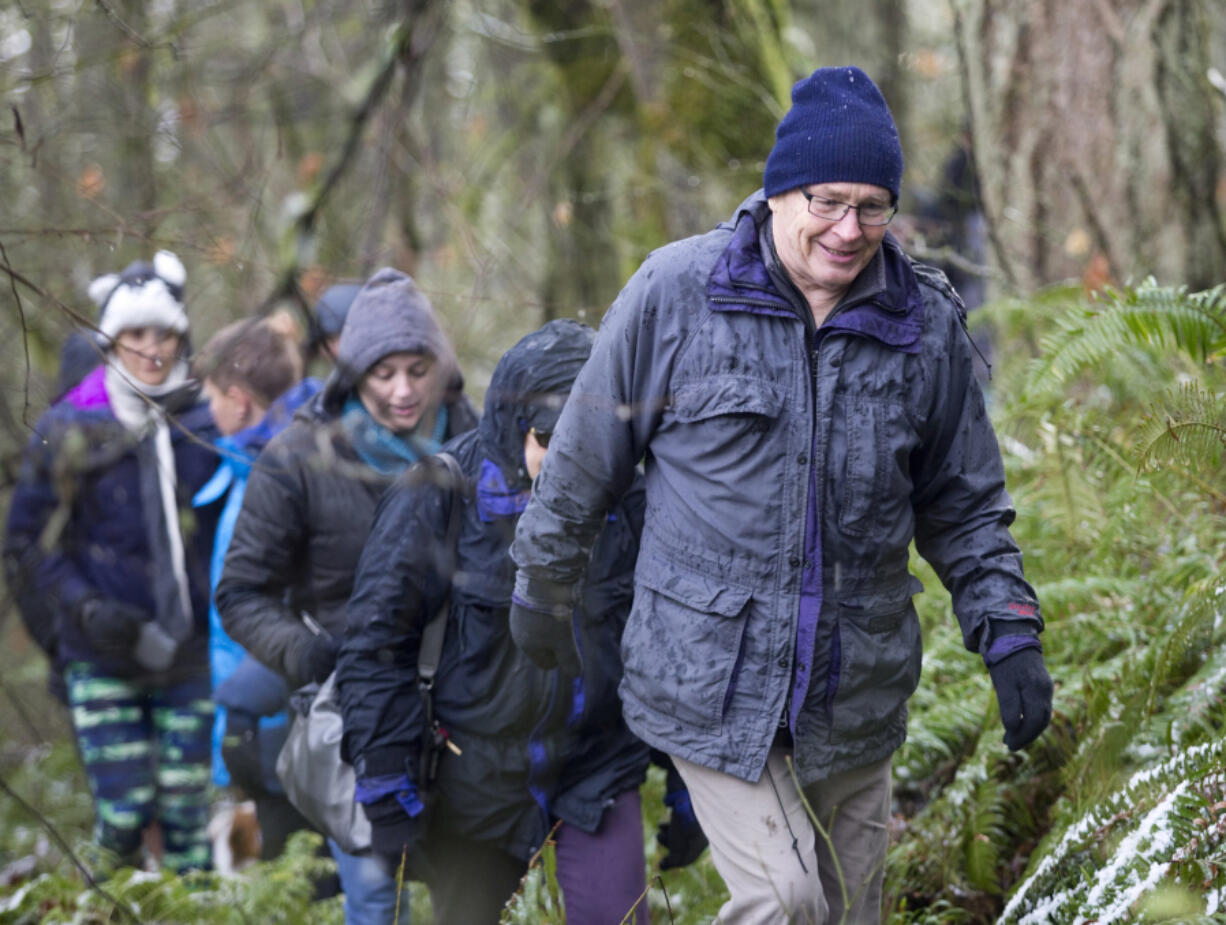 Mike Koon takes part in a hike on a guided tour offered by the park service Jan. 1, 2017, at Battle Ground Lake State Park. There will be two volunteer-led hikes this New Year's Day at the park, but space is limited and registration is required.