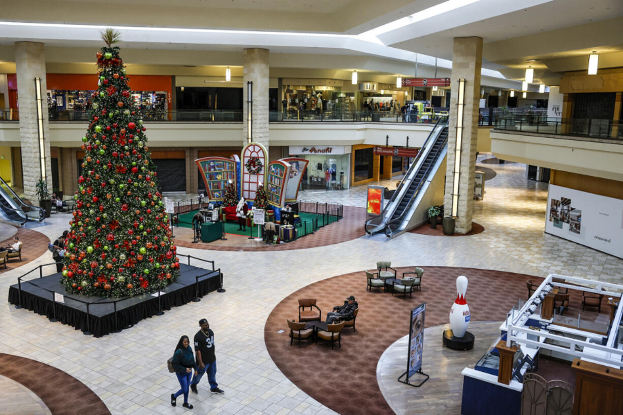 A light turnout of shoppers makes for a slow day for a Santa Claus photo spot at the Puente Hills Mall.