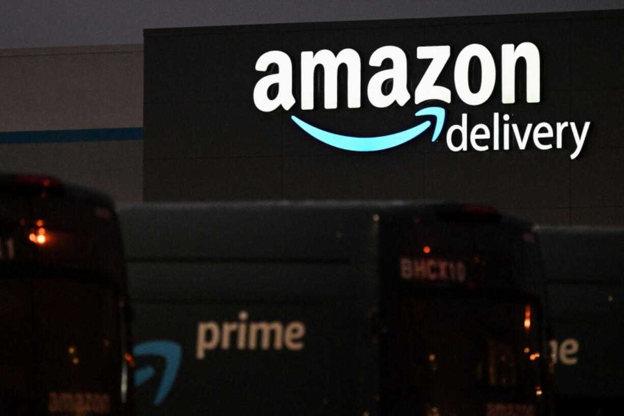 An Amazon sign is displayed outside of an Amazon.com Inc. delivery hub in the late evening of Amazon Prime Day, July 12, 2022, in Culver City, California. (Patrick T.