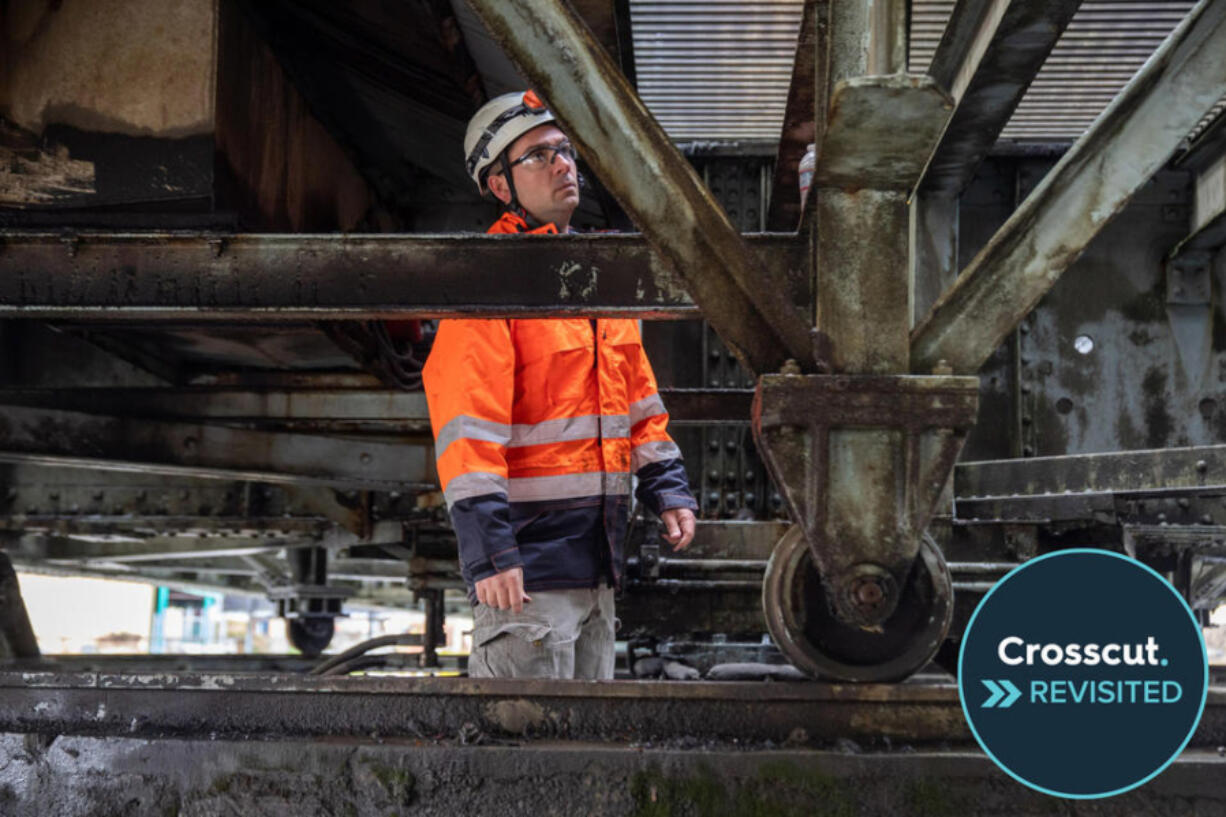 Colt Tatum, an engineer and supervisor of special structures for Washington State Department of Transportation, examines the Heron Street Bridge in Aberdeen.