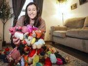 Caitlin Parylak surrounded by her dog toys inside her Northeast Philadelphia home. Parylak collects other people&rsquo;s used pet toys, makes them like new, and then gives them to animal shelters.