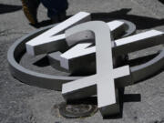 Characters removed from a sign on the Twitter headquarters building are piled on a street in San Francisco on July 24. A little more than a year ago, Elon Musk walked into Twitter&rsquo;s San Francisco headquarters, fired its CEO and other top executives and began transforming the social media platform into what&rsquo;s now known as X. (Godofredo A.