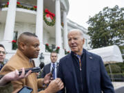 U.S. President Joe Biden talks to the press before boarding Marine One on the south lawn of the White House on Dec. 23, 2023, in Washington, DC.