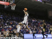 Gonzaga forward Anton Watson (22) goes up for a dunk during the second half of an NCAA college basketball game against Arkansas-Pine Bluff, Tuesday, Dec. 5, 2023, in Spokane, Wash. Gonzaga won 111-71.