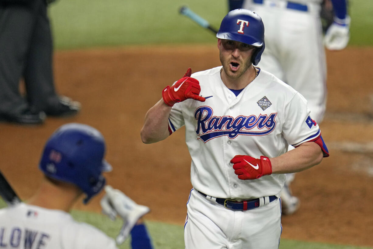 Mitch Garver, right, and the Seattle Mariners finalized a $24 million, two-year contract on Thursday, Dec. 28, 2023.