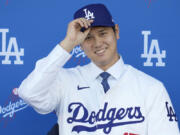 Los Angeles Dodgers&rsquo; Shohei Ohtani smiles during a baseball news conference at Dodger Stadium Thursday, Dec. 14, 2023, in Los Angeles.