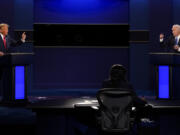 FILE - U.S. President Donald Trump, left, and Democratic presidential candidate former Vice President Joe Biden attend the second and final presidential debate Oct. 22, 2020, at Belmont University in Nashville, Tenn. Relatively few Americans are excited about a potential rematch of the 2020 election between President Joe Biden and Donald Trump. But more Republicans would be happy to have Trump as their nominee than Democrats would be with Biden. That&#039;s according to a new poll from The Associated Press-NORC Center for Public Affairs Research.