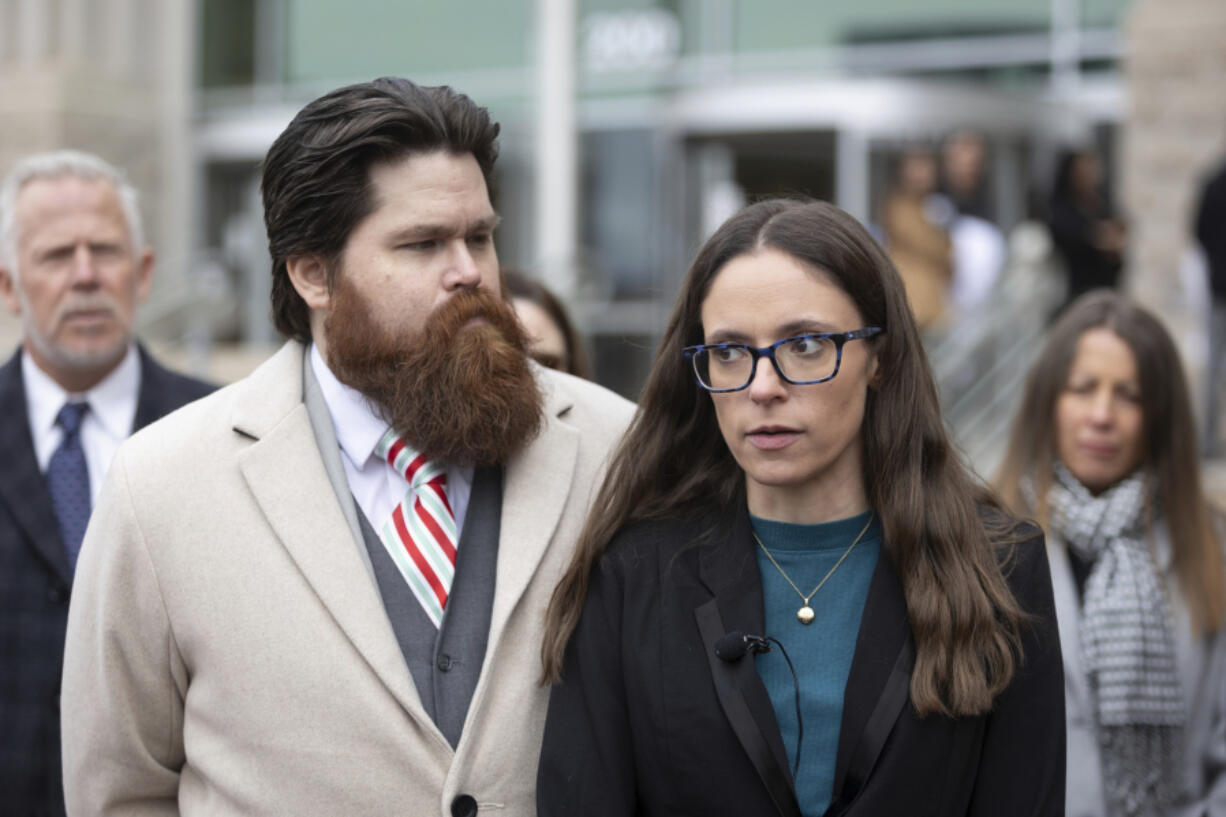 Jennifer Adkins and husband, John, from Caldwell, Idaho talk to the media outside the Ada County Courthouse, Thursday, Dec. 14, 2023 in Boise, Idaho. The two are plaintiffs in a case concerning access to abortive care in Idaho. An attorney for Idaho asked a judge on Thursday to throw out a lawsuit seeking clarity about the medical exemptions to the state&rsquo;s broad abortion bans, saying it was based on hypothetical situations rather than current facts.