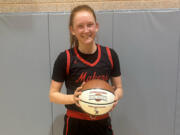 Camas senior Addison Harris holds a ball marking her 1,000th career point, scored in the Papermakers’ 51-45 win over Maret of Washington, D.C., in the Capitol Invitational on Thursday, Dec. 7, 2023 in Washington, D.C.