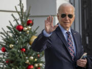 President Joe Biden waves as he walks to Marine One to depart the South Lawn of the White House, Tuesday, Dec. 5, 2023, in Washington. Biden is headed to Boston.