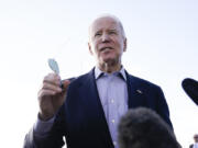 President Joe Biden speaks to the media before boarding Air Force One at Pueblo memorial Airport in Pueblo, Colo., Wednesday, Nov. 29, 2023, to travel back to Washington.