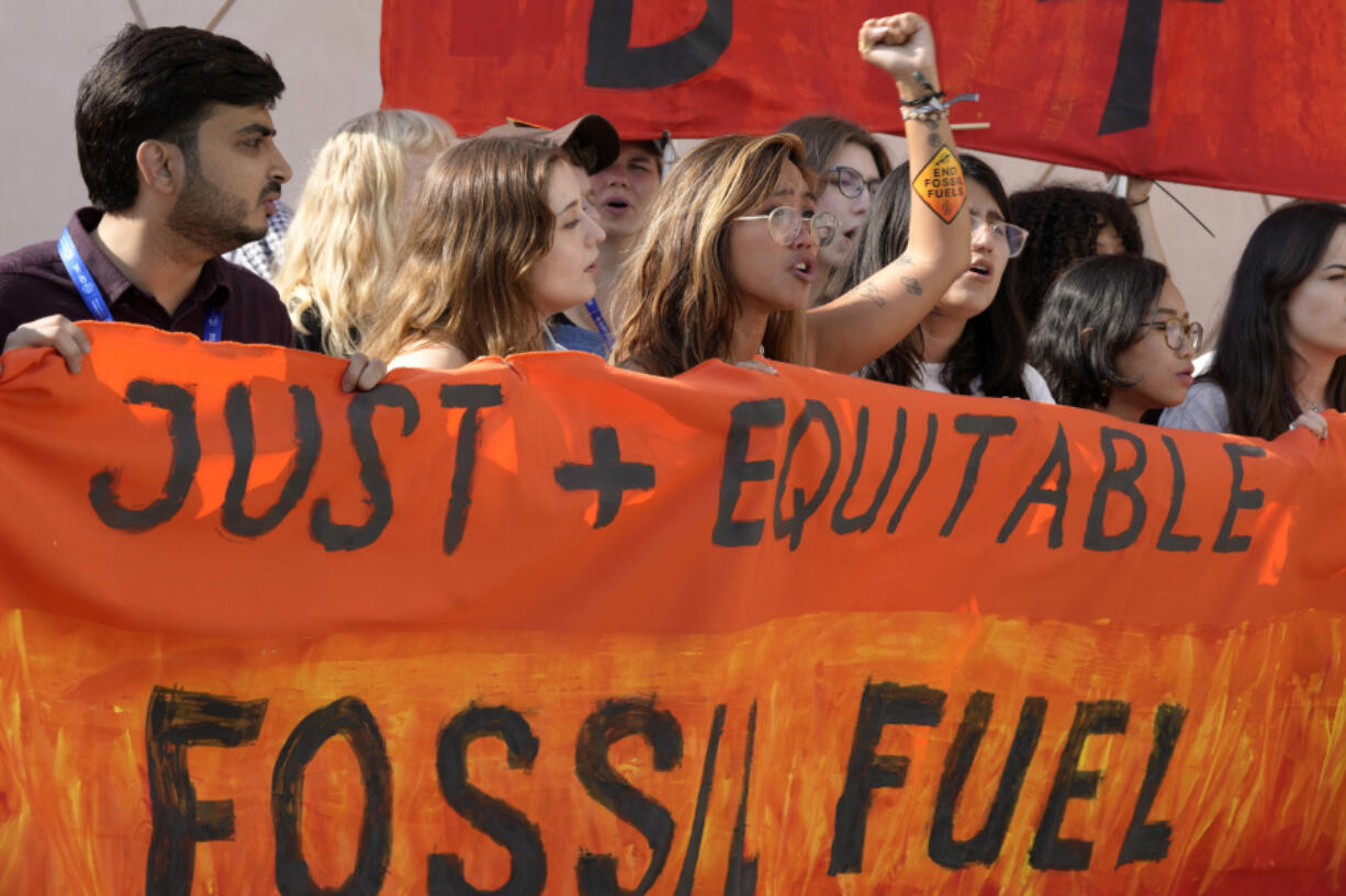 Mitzi Jonelle Tan, of the Philippines, participates in a demonstration with others against fossil fuels at the COP28 U.N. Climate Summit, Wednesday, Dec. 13, 2023, in Dubai, United Arab Emirates.