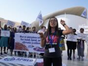 Activists demonstrate for rural people, food, land and climate justice at the COP28 U.N. Climate Summit, Wednesday, Dec. 6, 2023, in Dubai, United Arab Emirates.