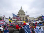 FILE - Rioters loyal to President Donald Trump at the U.S. Capitol in Washington, Jan. 6, 2021. A former leader of the far-right Proud Boys extremist group has been sentenced to more than three years behind bars for joining a plot to attack the U.S. Capitol nearly three years ago. Charles Donohoe was the second Proud Boy to plead guilty to conspiring with other group members to obstruct the Jan. 6, 2021, joint session of Congress for certifying President Joe Biden&rsquo;s electoral victory.