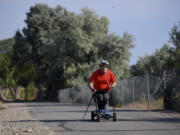 FILE - Kevin Hoyt rolls along as he exercises using a paraplegic-friendly mountainboard that was adapted for his use, July 8, 2017 along the Jordan River Parkway trail in Saratoga Springs, Utah. The U.S. Census Bureau wants to change how it asks people about disabilities, and some advocates are complaining that they were not consulted enough on what amounts to a major overhaul in how disabilities would be defined by the federal government.