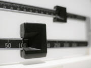 FILE - A beam scale is seen in New York on Tuesday, April 3, 2018. A study of young kids in the Women, Infants and Children program adds to evidence that severe obesity is becoming more common in young U.S. children. The update was published Monday, Dec. 18, 2023, in the journal Pediatrics.