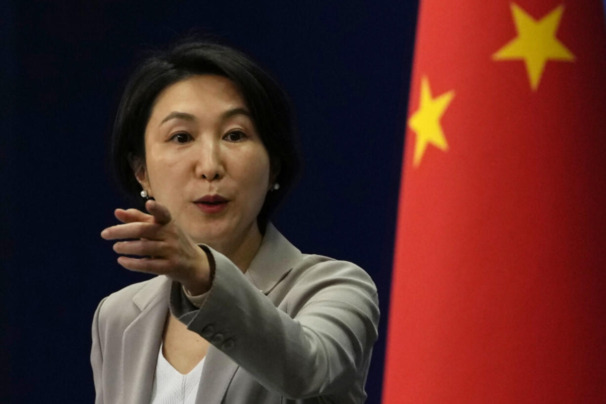 FILE - Chinese Foreign Ministry spokesperson Mao Ning gestures during a press conference at the Ministry of Foreign Affairs in Beijing, on July 26, 2023. China says it is banning a United States research company and two analysts who have reported extensively on claims of human rights abuses committed against Uyghurs and other Muslim minority groups native to the country&rsquo;s far northwestern region of Xinjiang.