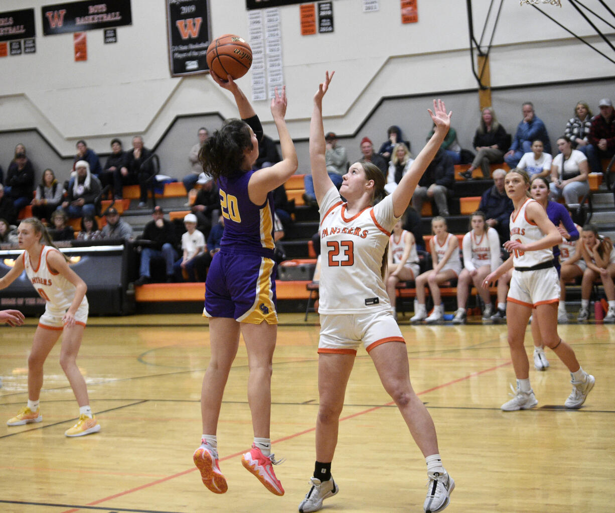 Columbia River's Emma Iniguez (20) takes a shot over Washougal's Bre Alldrin (23) during River's 68-47 win over the Panthers at Washougal High School on Thursday, Dec. 21, 2023.