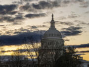 The Capitol is seen under a winter sky in Washington, Monday, Dec. 18, 2023, as White House and Senate negotiators are struggling to reach a U.S. border security deal that would unlock President Joe Biden&#039;s request for billions of dollars worth in military aid for Ukraine and national security. (AP Photo/J.