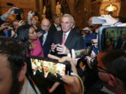 FILE - Reporters surround Rep. Kevin McCarthy, R-Calif., as he walks out of the House chambers after the House met for the third day to elect a speaker and convene the 118th Congress in Washington, Thursday, Jan. 5, 2023.