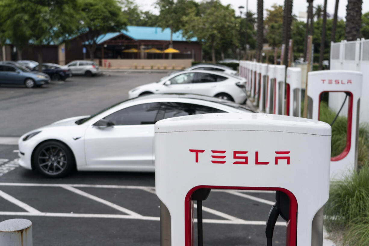 File - Tesla electric vehicles are charged at a charging station in Anaheim, Calif., June 9, 2023. (AP Photo/Jae C.