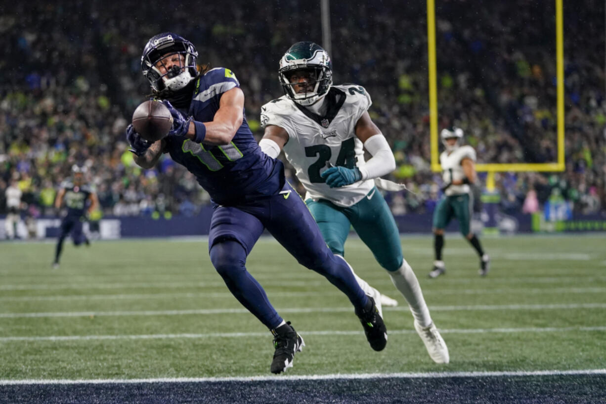 Seattle wide receiver Jaxon Smith-Njigba (11) makes a 29-yard touchdown catch in front of Philadelphia cornerback James Bradberry (24) in the final seconds of the fourth quarter Monday to cap the Seahawks&rsquo; 92-yard game-winning drive.