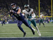 Seattle wide receiver Jaxon Smith-Njigba (11) makes a 29-yard touchdown catch in front of Philadelphia cornerback James Bradberry (24) in the final seconds of the fourth quarter Monday to cap the Seahawks&rsquo; 92-yard game-winning drive.