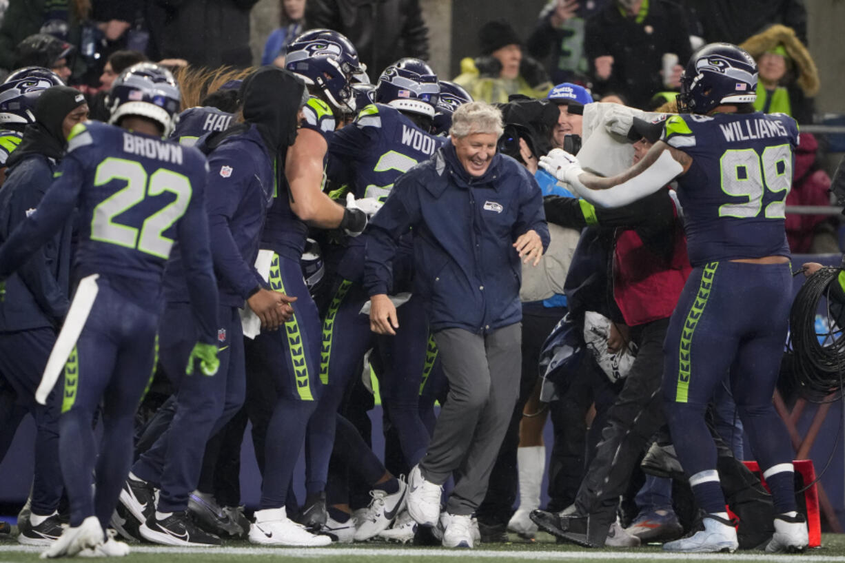 Seattle Seahawks head coach Pete Carroll reacts as players gather during the second half of an NFL football game against the Philadelphia Eagles, Monday, Dec. 18, 2023, in Seattle. The Seahawks won 20-17.