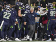 Seattle Seahawks head coach Pete Carroll reacts as players gather during the second half of an NFL football game against the Philadelphia Eagles, Monday, Dec. 18, 2023, in Seattle. The Seahawks won 20-17.