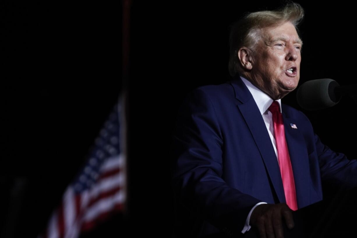 FILE - Former President Donald Trump speaks at a rally, Aug. 5, 2022, in Waukesha, Wis. Ten Republicans who posed as fake electors for former President Trump in Wisconsin and filed paperwork falsely saying he had won the battleground state have settled a civil lawsuit and admitted their actions were part of an effort to overturn President Joe Biden&#039;s victory, attorneys who filed the case announced Wednesday, Dec. 6, 2023.