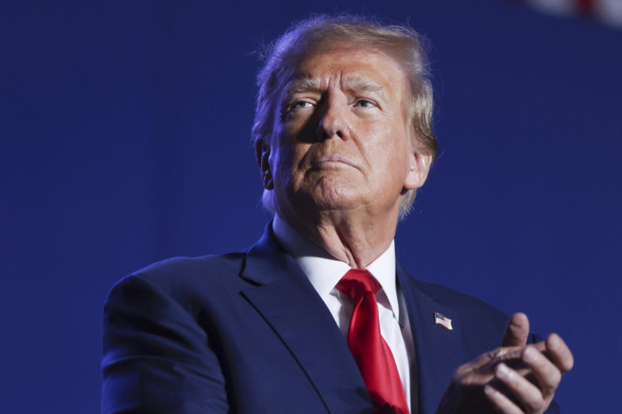 FILE - Former President Donald Trump speaks at a campaign rally, Saturday, Dec. 16, 2023, in Durham, N.H. Trump is facing criticism for repeatedly harnessing rhetoric once used by Adolf Hitler to argue that immigrants entering the U.S. illegally are &ldquo;poisoning the blood of our country. Trump insists he had no idea that one of the world&rsquo;s most reviled and infamous figures once used similar words.