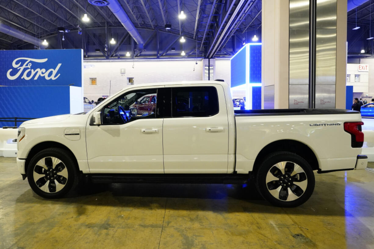 FILE - The Ford F-150 Lightning displayed at the Philadelphia Auto Show, Jan. 27, 2023, in Philadelphia. The Biden administration has proposed new rules that could make it harder for electric vehicles to qualify for a full $7,500 federal tax credit. The rules announced Dec. 1 could complicate efforts to meet President Joe Biden&rsquo;s goal that half of new passenger vehicles sold in the U.S. run on electricity by 2030.