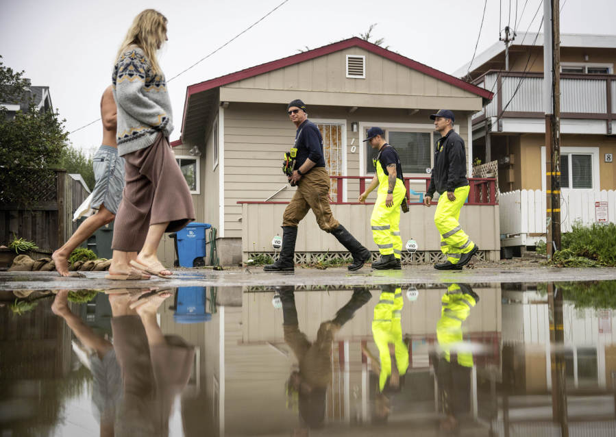 Huge surf pounds beaches on West Coast and in Hawaii with some low-lying  coastal areas flooding