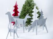 Minimalist contemporary wooden Christmas trees and reindeer fit together with simple slots, and are easy to stash under a bed or behind a cupboard.