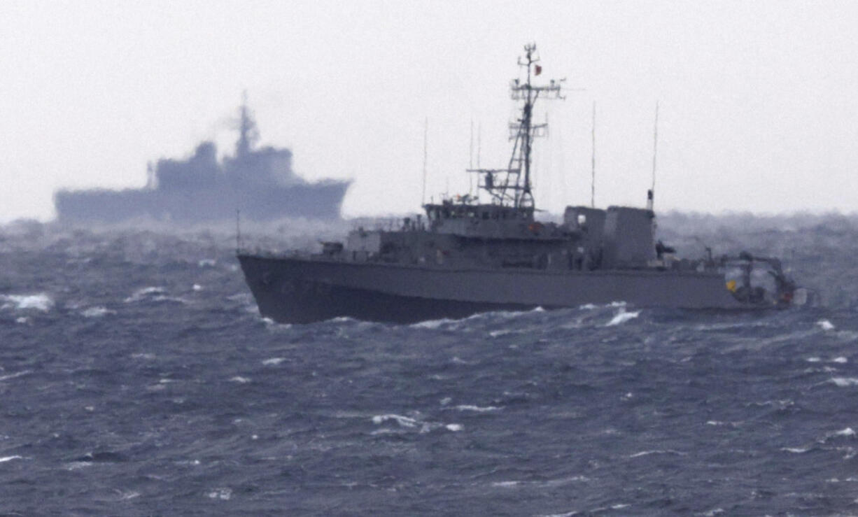 A Japanese Maritime Self Defense Force minesweeper searches in the waters where a U.S. military Osprey aircraft crashed, off Yakushima, Kagoshima prefecture, southern Japan, Friday, Dec. 1, 2023. Japan suspended flights by its Osprey aircraft Thursday, officials said, the day after the U.S. Air Force Osprey based in Japan crashed into the sea during a training mission.