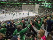 Dallas Stars fans celebrate after their team&rsquo;s overtime victory over the Seattle Kraken in an NHL hockey game Monday, Dec. 18, 2023, at American Airlines Center in Dallas.