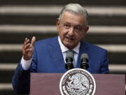 FILE - Mexican President Andres Manuel Lopez Obrador speaks at the National Palace in Mexico City, Jan. 10, 2023. Mexico&rsquo;s president vowed Monday, Dec. 11, 2023 to try to eliminate almost all remaining government oversight and regulatory agencies before he leaves office on Sept. 30, claiming they are &ldquo;useless&rdquo; and cost too much.