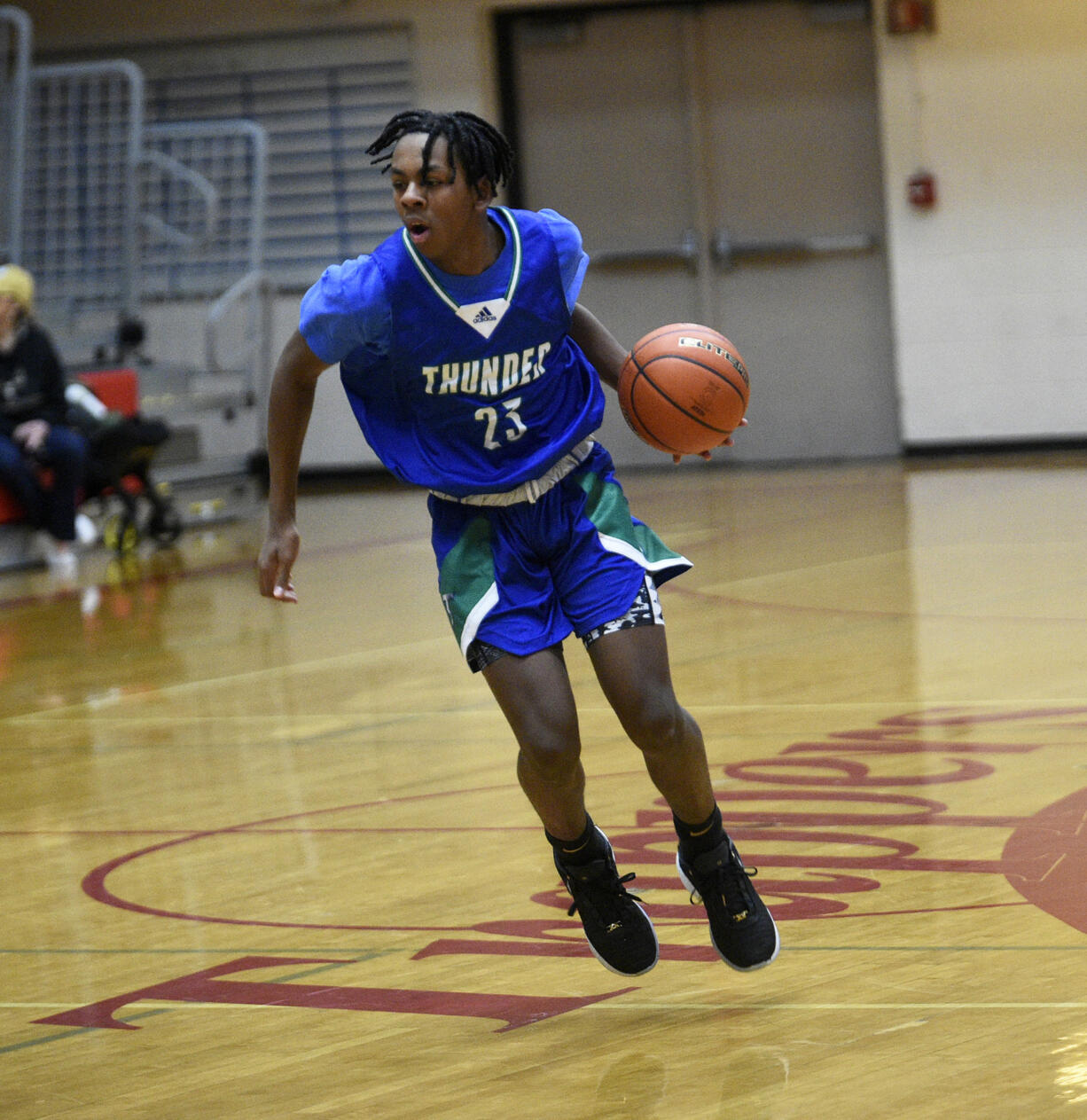 Malcolm Weatherspoon of Mountain View dribbles the ball against North Thurston in the Myron Lawrence Memorial Tournament at Fort Vancouver High School on Thursday, Dec. 28, 2023.