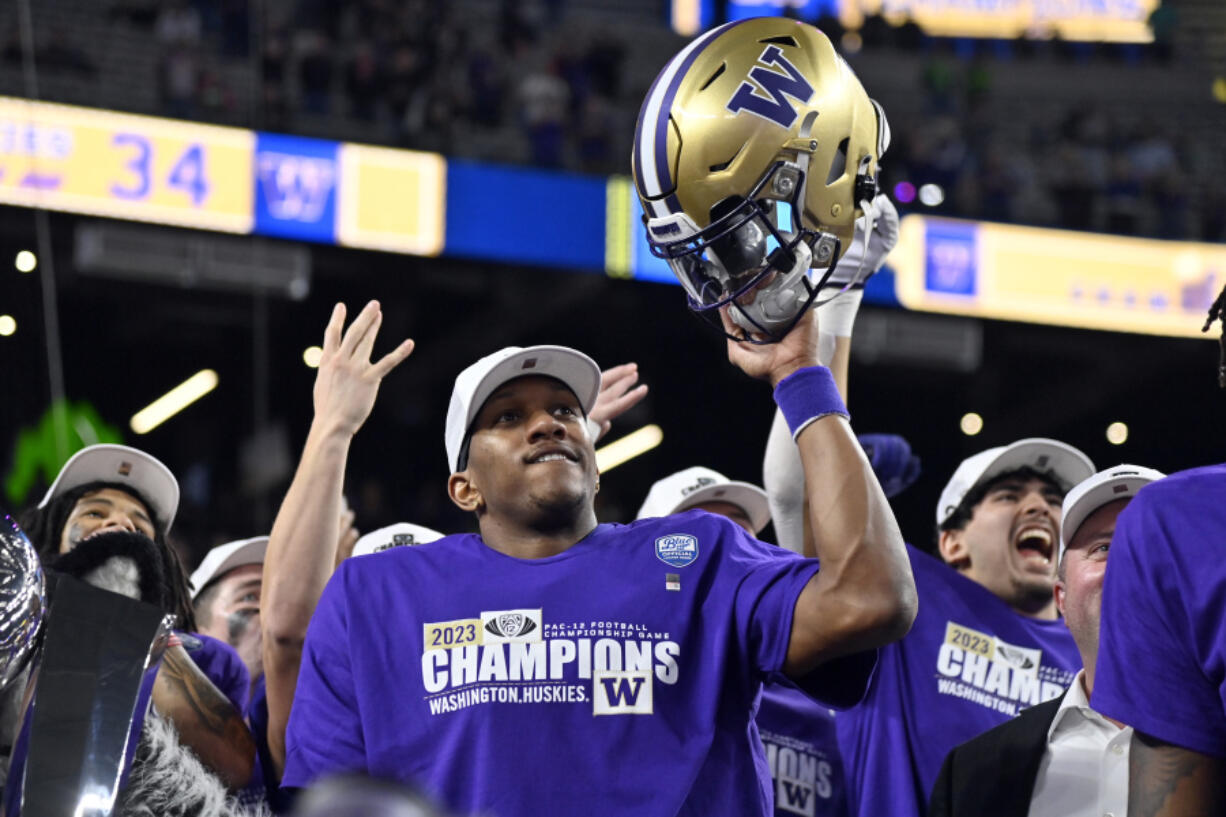 Washington quarterback Michael Penix Jr. celebrates after the team defeated Oregon in the Pac-12 championship NCAA college football game Friday, Dec. 1, 2023, in Las Vegas.