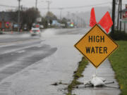 Heavy rain causes high water and flooding along Highway 101 in Tillamook, Ore., on Tuesday, Dec. 5, 2023.