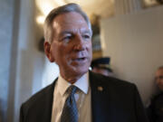 FILE - Sen. Tommy Tuberville, R-Ala., a member of the Senate Armed Services Committee, talks to reporters as he and other senators arrive at the chamber for votes, at the Capitol in Washington, Wednesday, Sept. 6, 2023. (AP Photo/J.