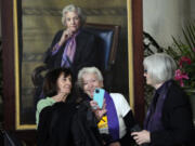 Dega Schembri, left, and Sheridan Harvey take a photo during the public repose for retired Supreme Court Justice Sandra Day O&rsquo;Connor in the Great Hall at the Supreme Court in Washington, Monday, Dec. 18, 2023. O&rsquo;Connor, an Arizona native and the first woman to serve on the nation&rsquo;s highest court, died Dec. 1 at age 93. Former law clerks of O&rsquo;Connor stand at left and right. They were both in exercise class with O&rsquo;Connor.