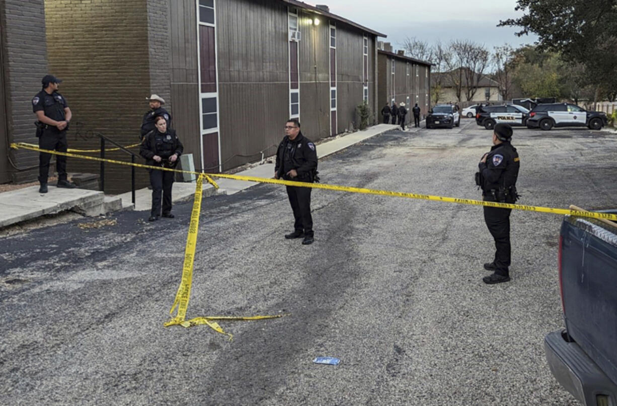 Police rope off the scene where two dead bodies were discovered on Tuesday, Dec. 26, 2023 in San Antonio, Texas.  The dead bodies that Texas investigators believe to have been a pregnant woman and her boyfriend were found with gunshot wounds days after they were reported missing, police said Wednesday.