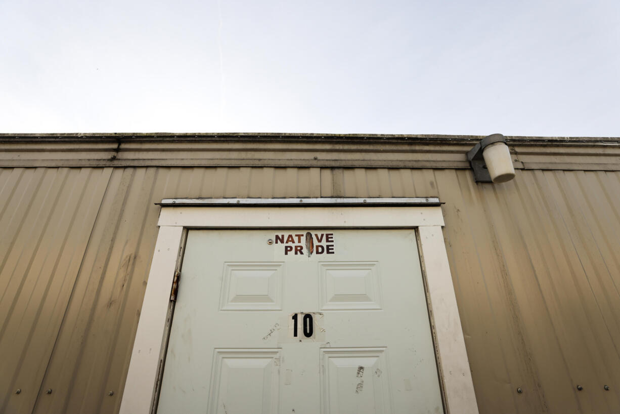 A door to a room in a trailer reads “Native pride” at Chief Seattle Club's Eagle Village, a shelter for Native people, on Wednesday, Dec. 13, 2023.