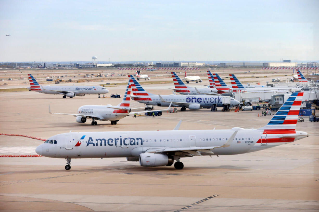 An American Airlines jet taxis to the runway after leaving a Terminal C gate at Dallas-Fort Worth Airport in Texas on Nov. 27.