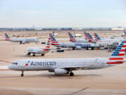 An American Airlines jet taxis to the runway after leaving a Terminal C gate at Dallas-Fort Worth Airport in Texas on Nov. 27.