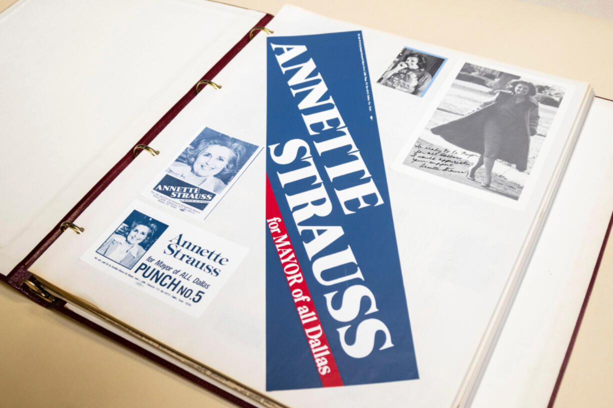 A page from one of Annette Strauss&rsquo; many scrapbooks, part of the collection now with the Dallas Municipal Archives, includes campaign photos, handouts for voters and a bumper sticker for her supporters.