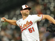 Baltimore Orioles relief pitcher Austin Voth throws a pitch during the eighth inning of a baseball game between the Baltimore Orioles and the Toronto Blue Jays, Tuesday, June 13, 2023, in Baltimore. The Orioles won 11-6.