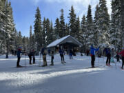 The Ray Garey Cabin at Teacup Nordic has a warming stove plus benches and tables for eating lunch.